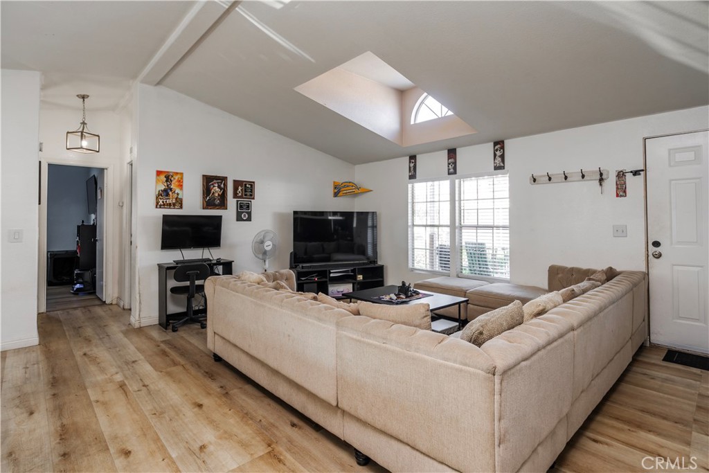 10350 Base Line Road, Unit 192 Rancho Cucamonga, CA 91701 - Photo 6 of 35 a living room with furniture and a flat screen tv