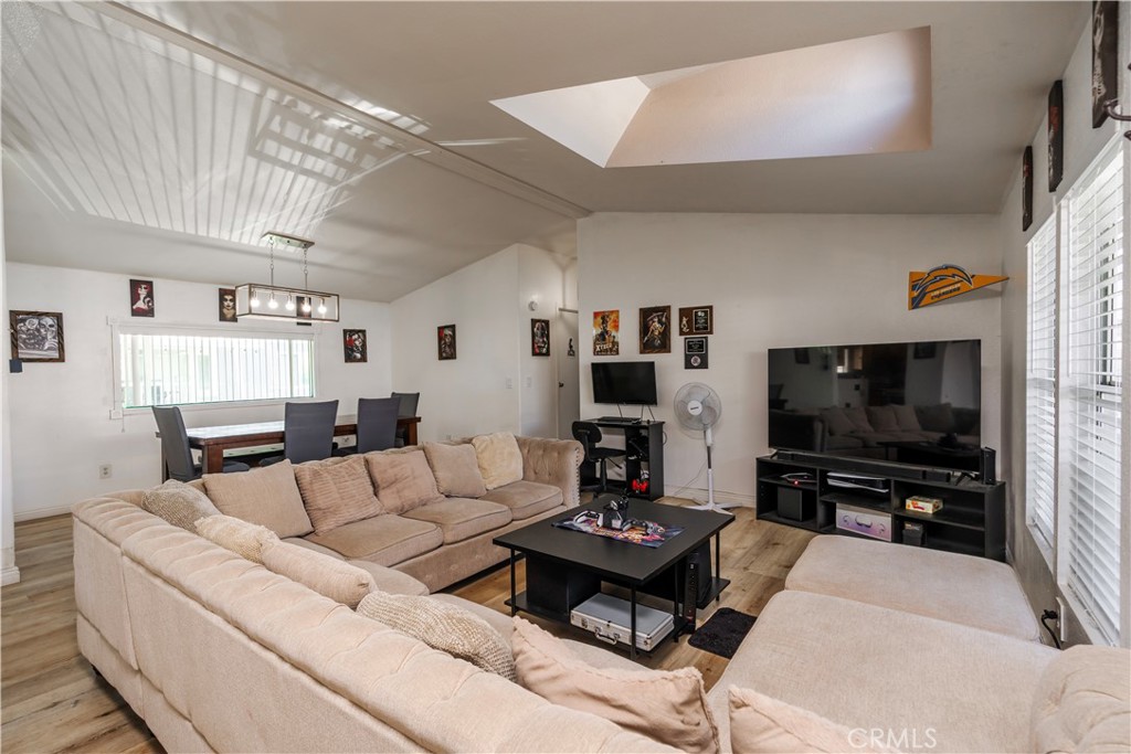 10350 Base Line Road, Unit 192 Rancho Cucamonga, CA 91701 - Photo 7 of 35 a living room with furniture and a flat screen tv