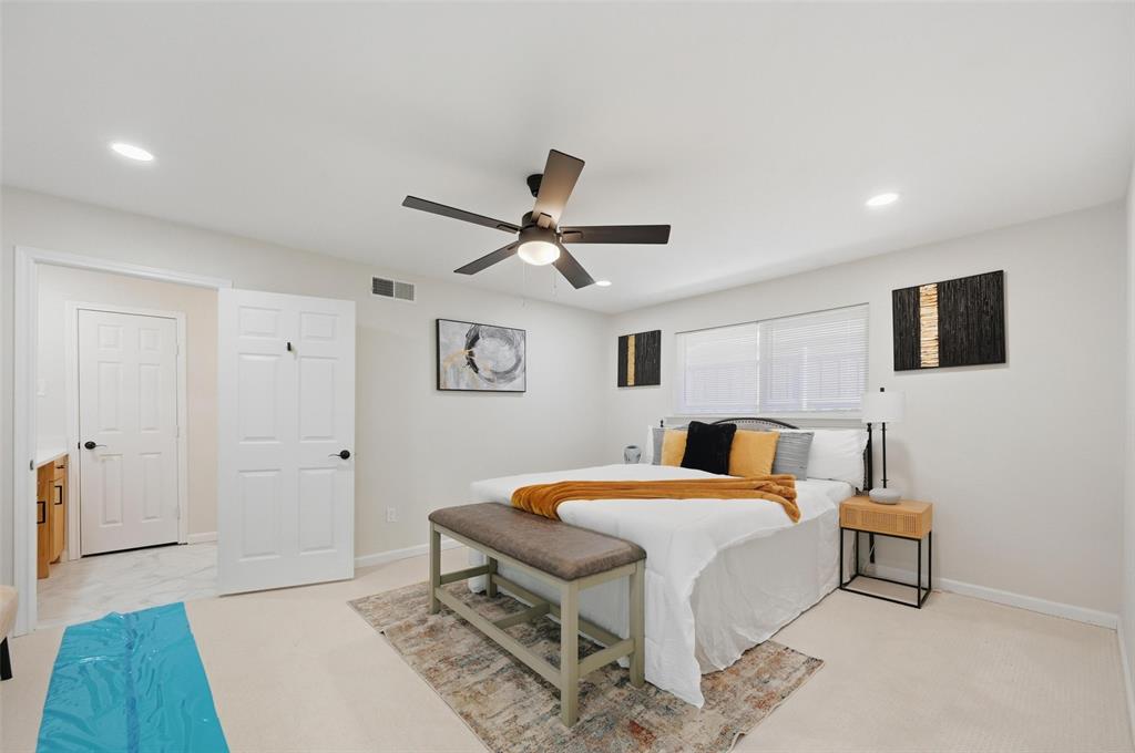 2709 Quail Ridge Drive Carrollton, TX 75006 - Photo 12 of 28 a bedroom with a bed and a dresser