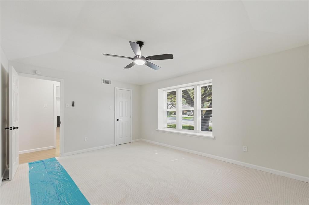 2709 Quail Ridge Drive Carrollton, TX 75006 - Photo 16 of 28 a view of an empty room with a window
