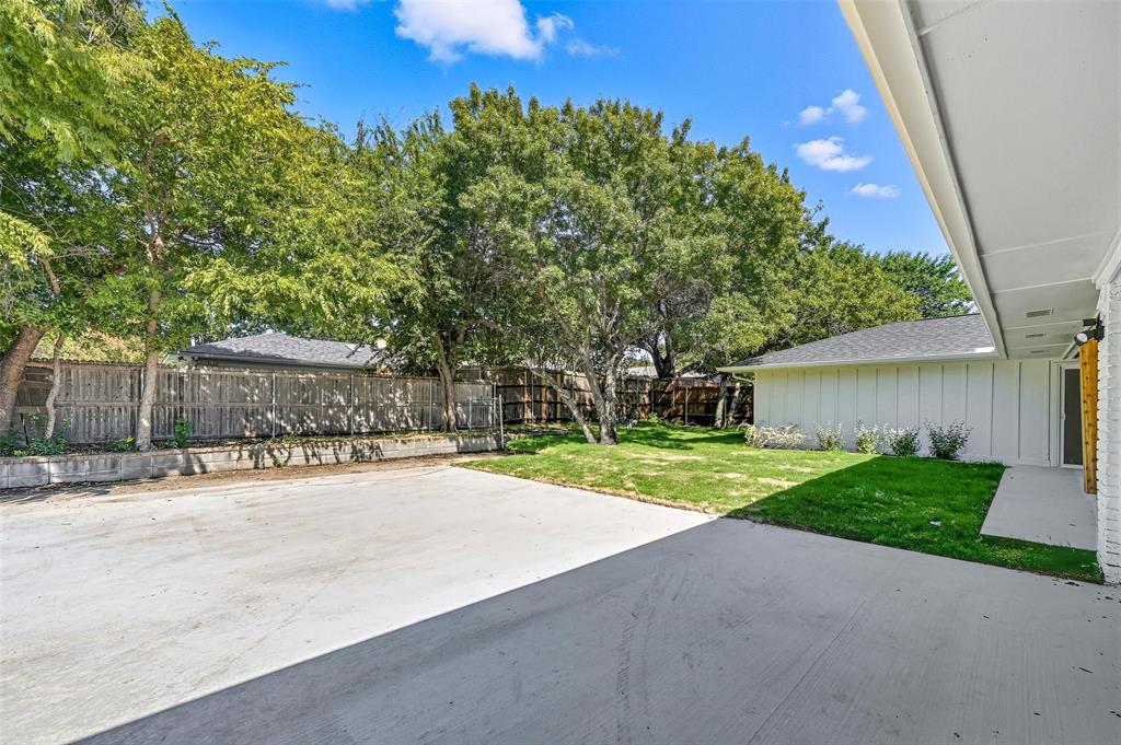 2709 Quail Ridge Drive Carrollton, TX 75006 - Photo 25 of 28 a road view with a garden