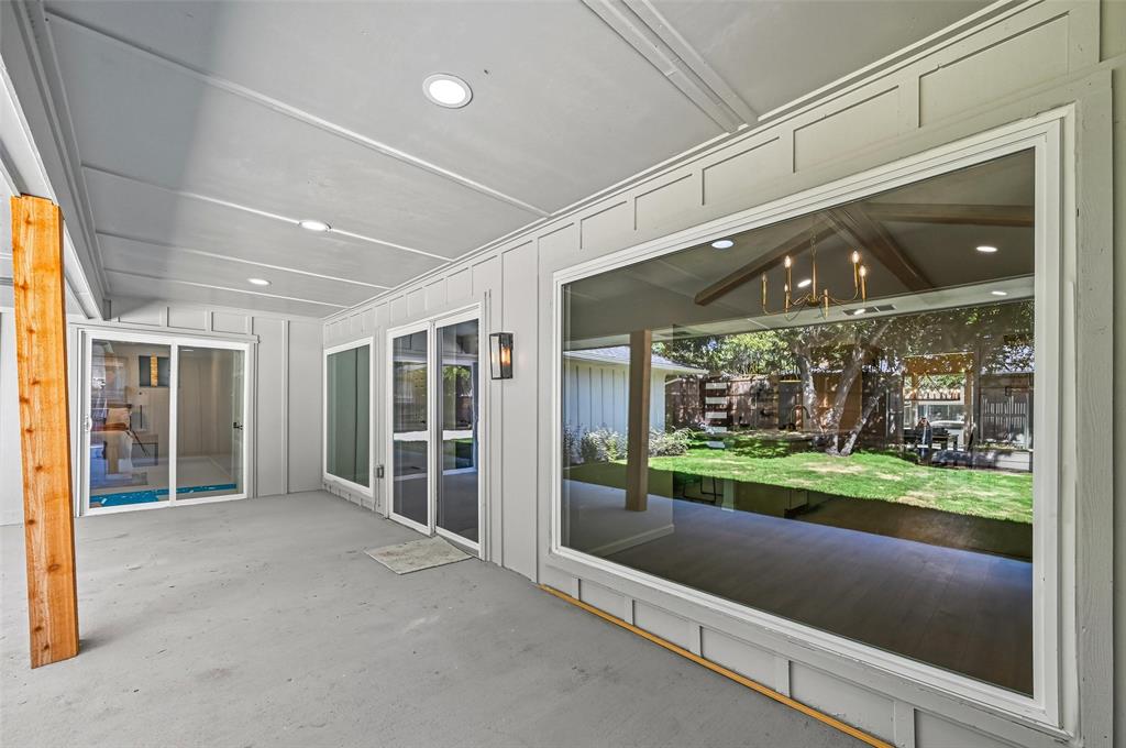 2709 Quail Ridge Drive Carrollton, TX 75006 - Photo 26 of 28 a view of a porch with furniture and garden