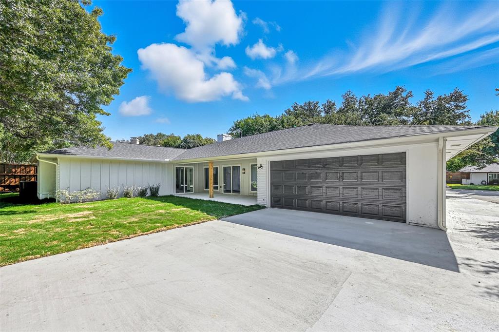 2709 Quail Ridge Drive Carrollton, TX 75006 - Photo 27 of 28 a view of a house with a yard and large tree