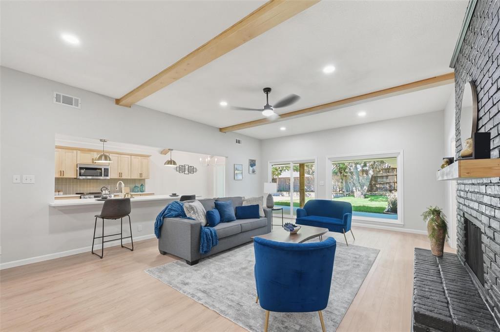 2709 Quail Ridge Drive Carrollton, TX 75006 - Photo 4 of 28 a living room with furniture and a fireplace