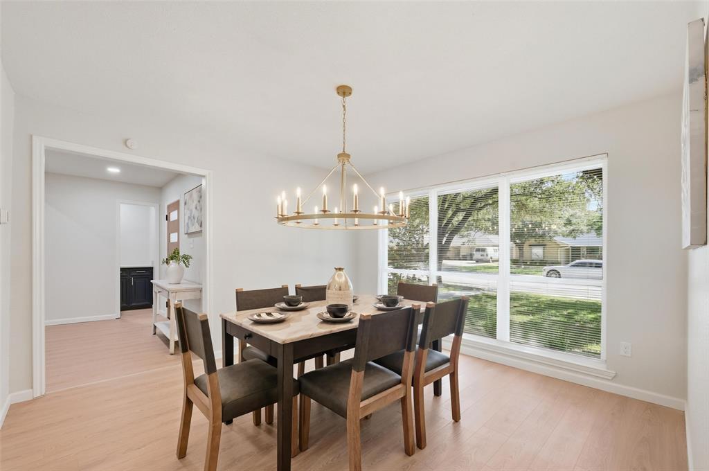 2709 Quail Ridge Drive Carrollton, TX 75006 - Photo 6 of 28 a view of a dining room with furniture window and outside view