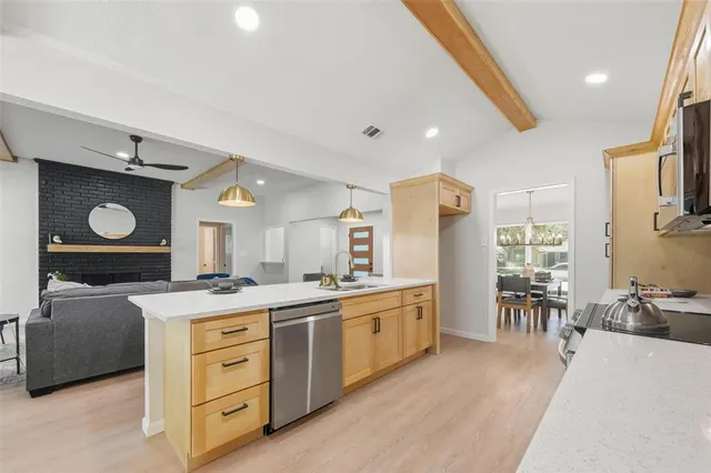 a kitchen with a stove a refrigerator and a stove