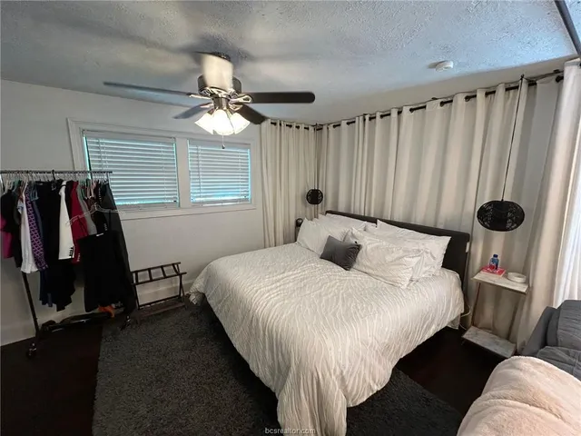 a bedroom with bed and a window