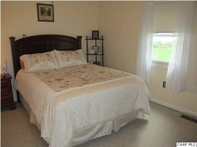 1009 Birdwood Road Charlottesville, VA 22903 - Photo 11 of 25 Master Bedroom w/ carpet and attached bathroom