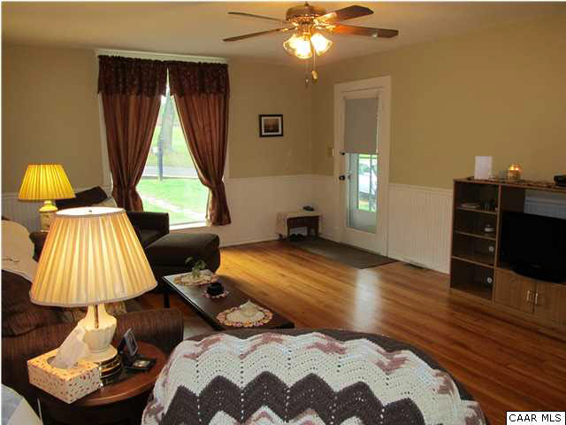 1009 Birdwood Road Charlottesville, VA 22903 - Photo 6 of 25 Spacious Living Room w/ large front window, ceiling fan, and hardwood floors.