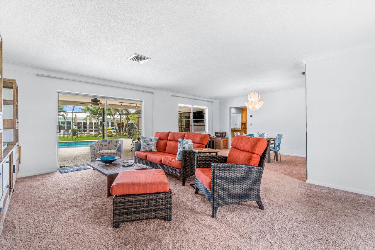 1350 Southwest 13th Place Boca Raton, FL 33486 - Photo 11 of 26 a living room with furniture and a large window