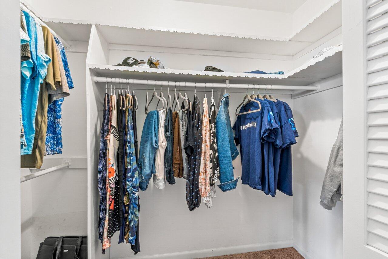 1350 Southwest 13th Place Boca Raton, FL 33486 - Photo 17 of 26 a view of walk in closet with clothes