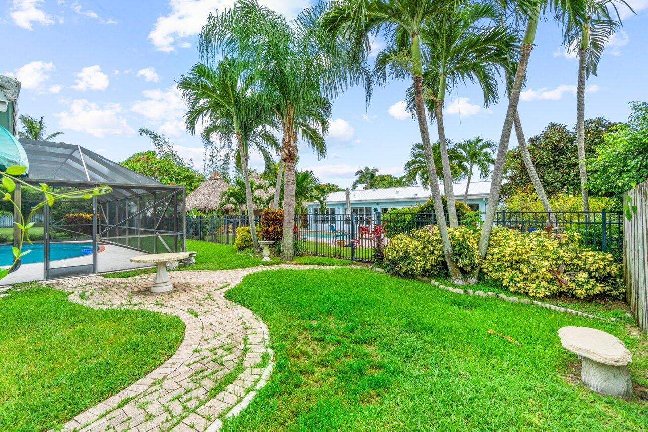 1350 Southwest 13th Place Boca Raton, FL 33486 - Photo 25 of 26 a view of a backyard with a garden