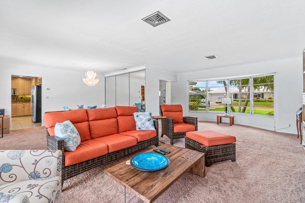 1350 Southwest 13th Place Boca Raton, FL 33486 - Photo 10 of 26 a living room with furniture and a large window