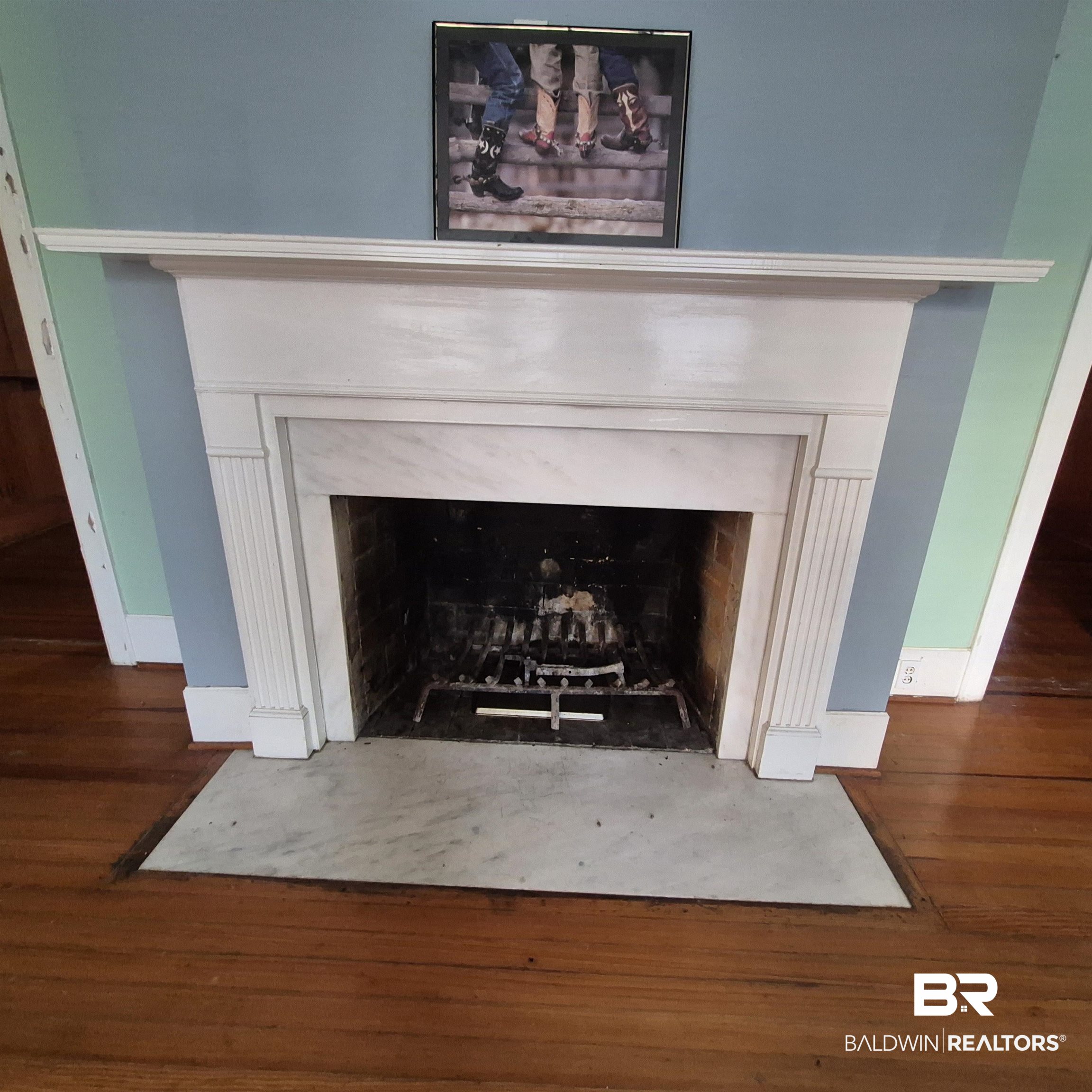 308 Rural Street Evergreen, AL 36401 - Photo 5 of 40 Detailed view of a fireplace with flush hearth and wood finished floors