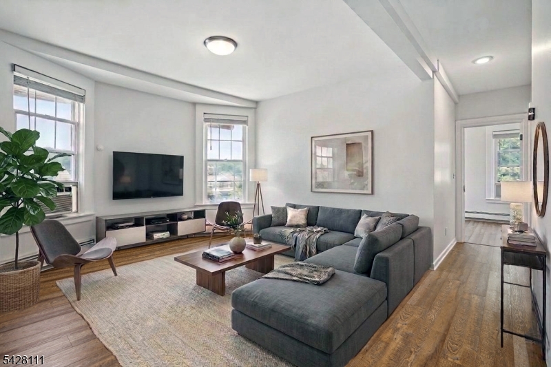 60 2nd Street South Orange, NJ 07079 - Photo 1 of 18 a living room with furniture and a flat screen tv