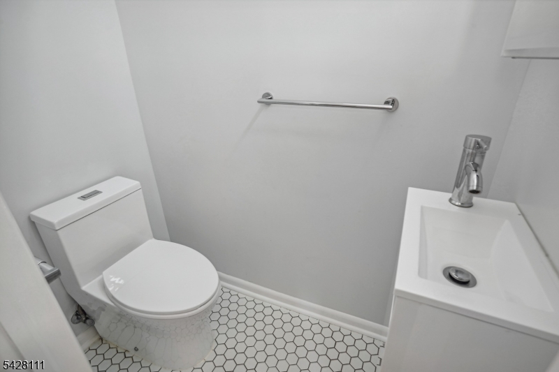 60 2nd Street South Orange, NJ 07079 - Photo 11 of 18 a bathroom with a sink and a toilet