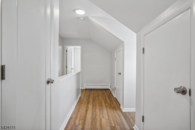 60 2nd Street South Orange, NJ 07079 - Photo 14 of 18 a view of a hallway with wooden floor and staircase