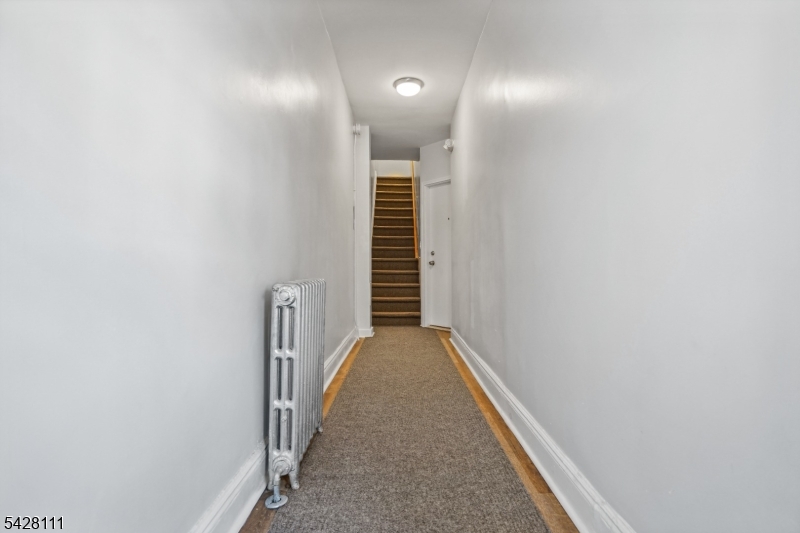 60 2nd Street South Orange, NJ 07079 - Photo 15 of 18 a view of a hallway with wooden staircase