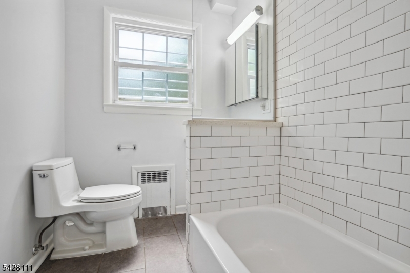 60 2nd Street South Orange, NJ 07079 - Photo 5 of 18 a bathroom with a toilet and a bathtub