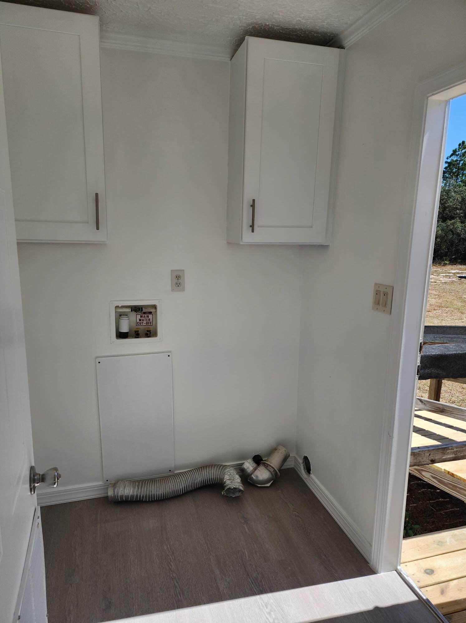 268 Don Graff Road Freeport, FL 32439 - Photo 18 of 20 an empty room with wooden floor and windows