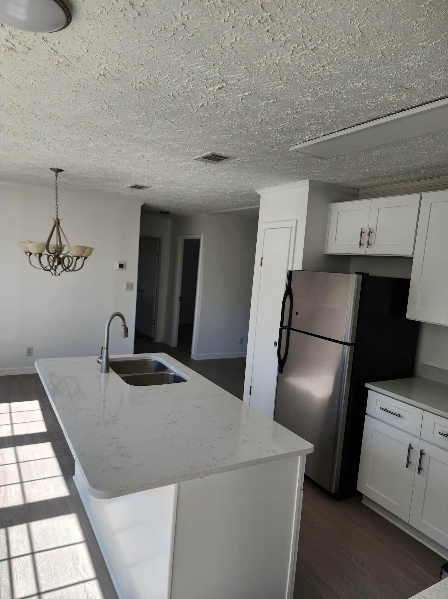 268 Don Graff Road Freeport, FL 32439 - Photo 5 of 20 a kitchen with a refrigerator and a sink