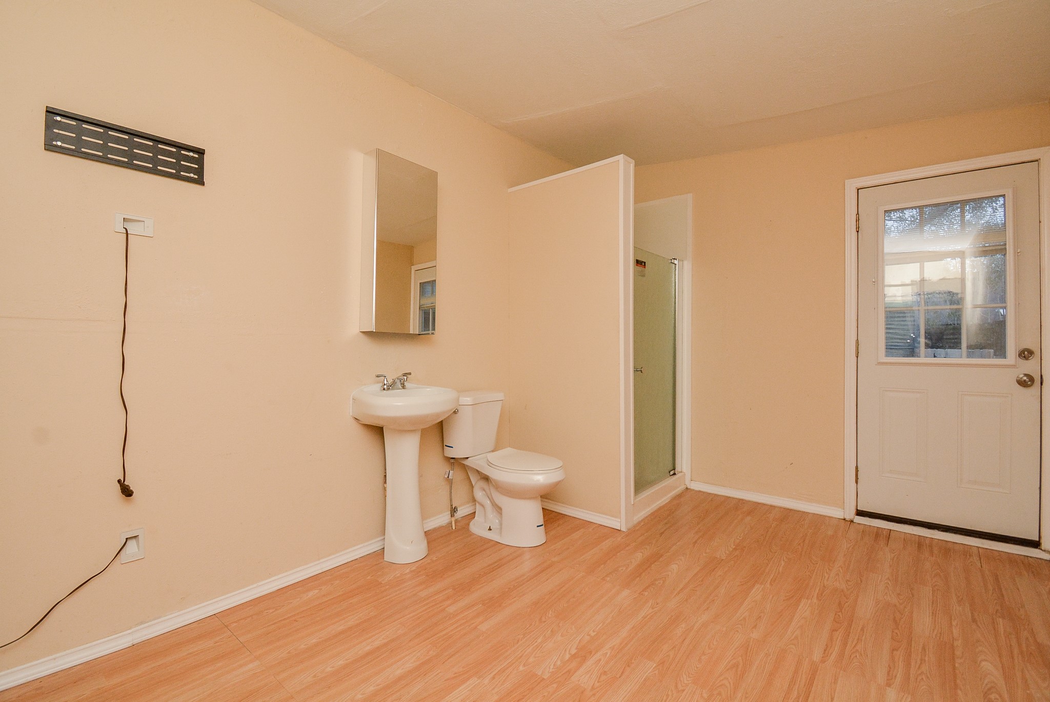 22906 Indian Ridge Drive Katy, TX 77450 - Photo 13 of 26 a bathroom with a toilet sink and shower