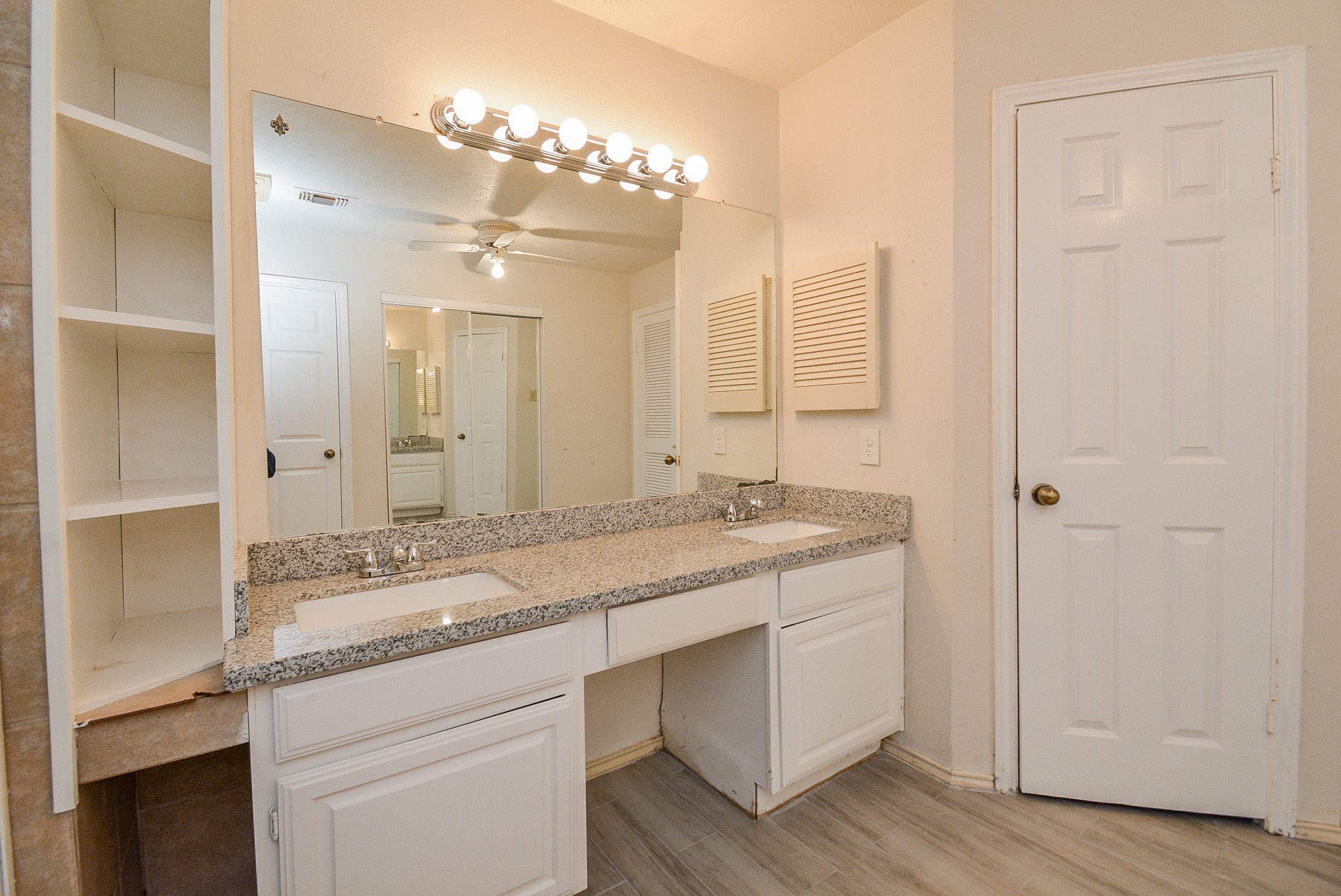 22906 Indian Ridge Drive Katy, TX 77450 - Photo 15 of 26 a bathroom with a granite countertop sink and a mirror