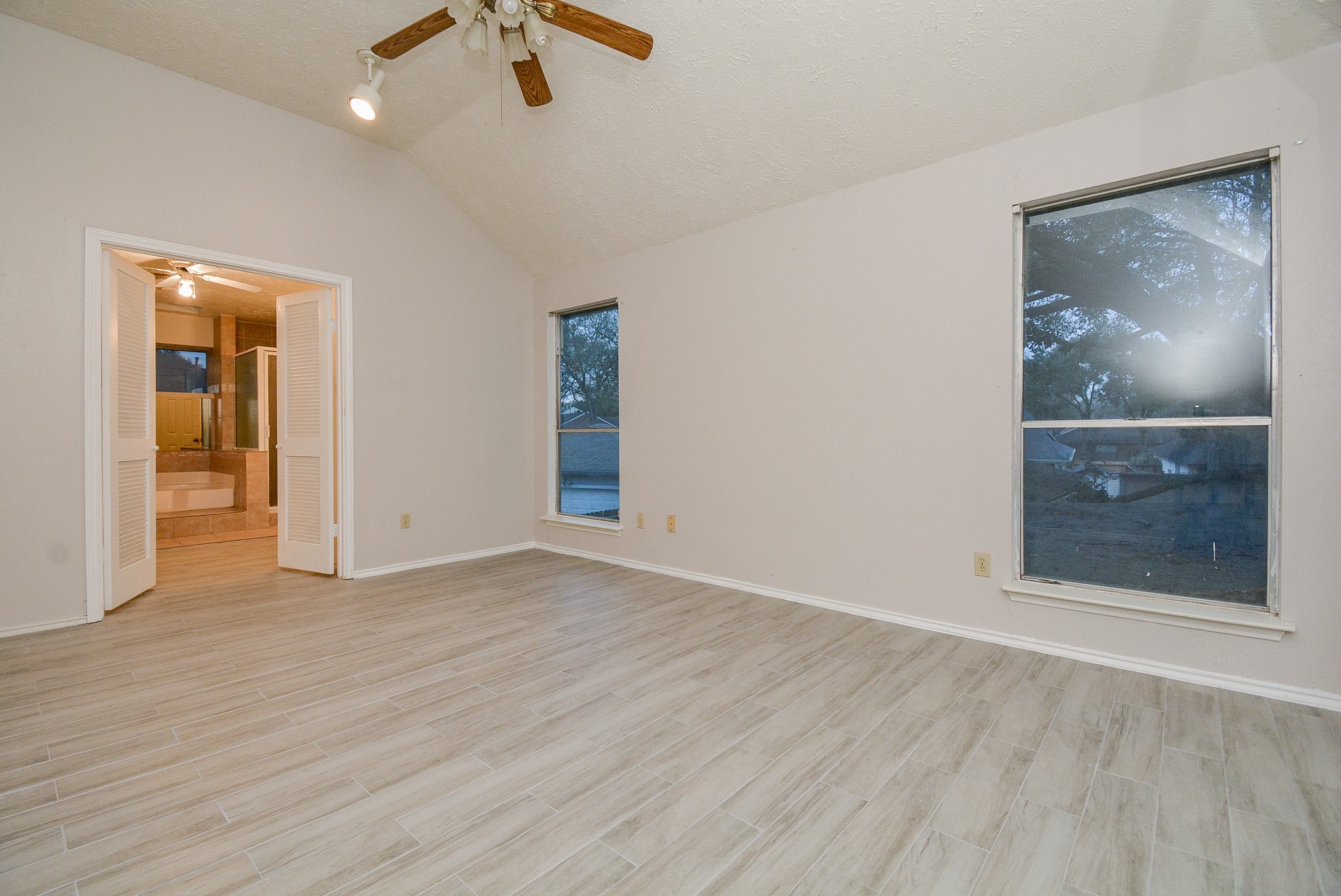 22906 Indian Ridge Drive Katy, TX 77450 - Photo 18 of 26 wooden floor in an empty room with a window
