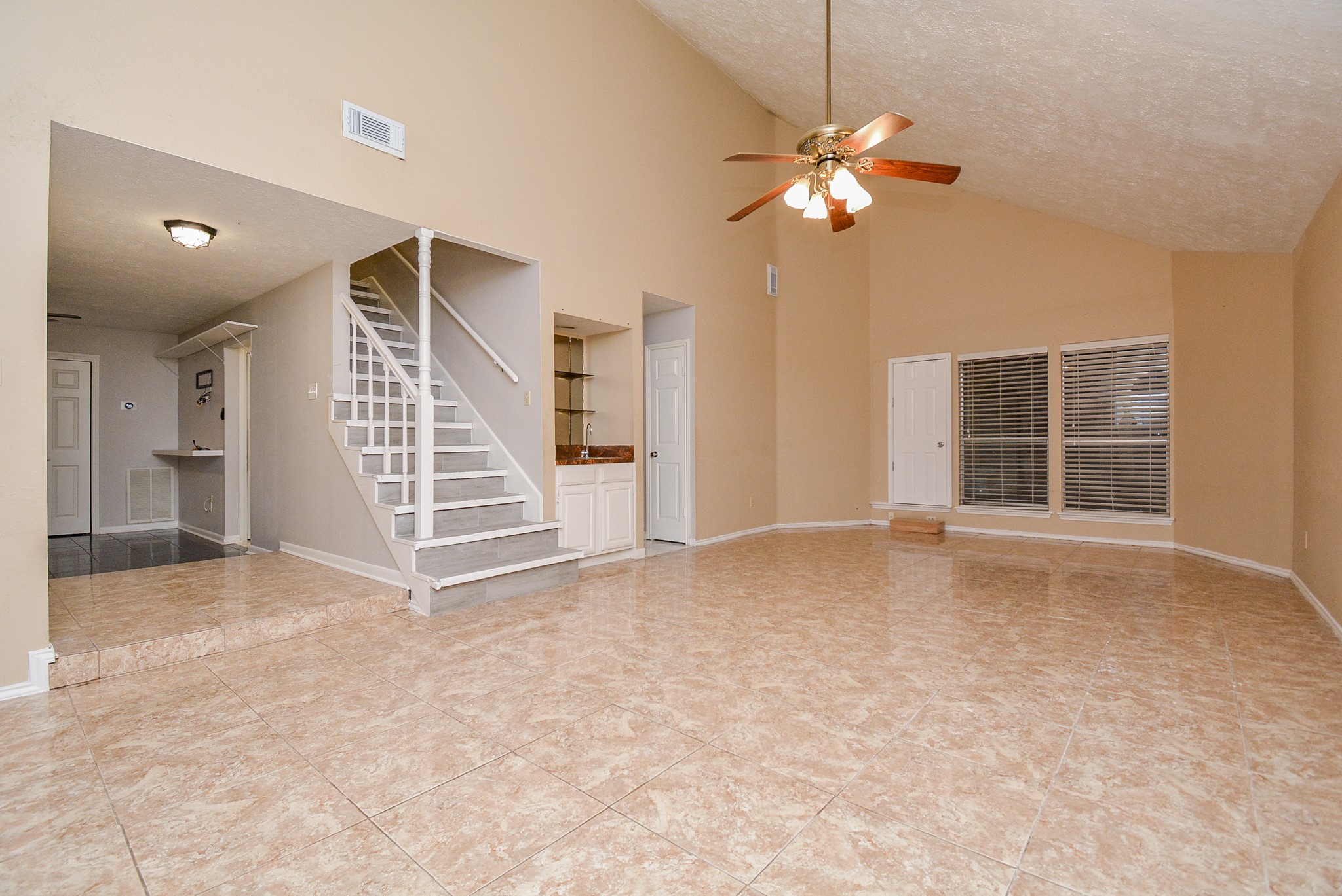 22906 Indian Ridge Drive Katy, TX 77450 - Photo 5 of 26 a view of a livingroom with a ceiling fan and window
