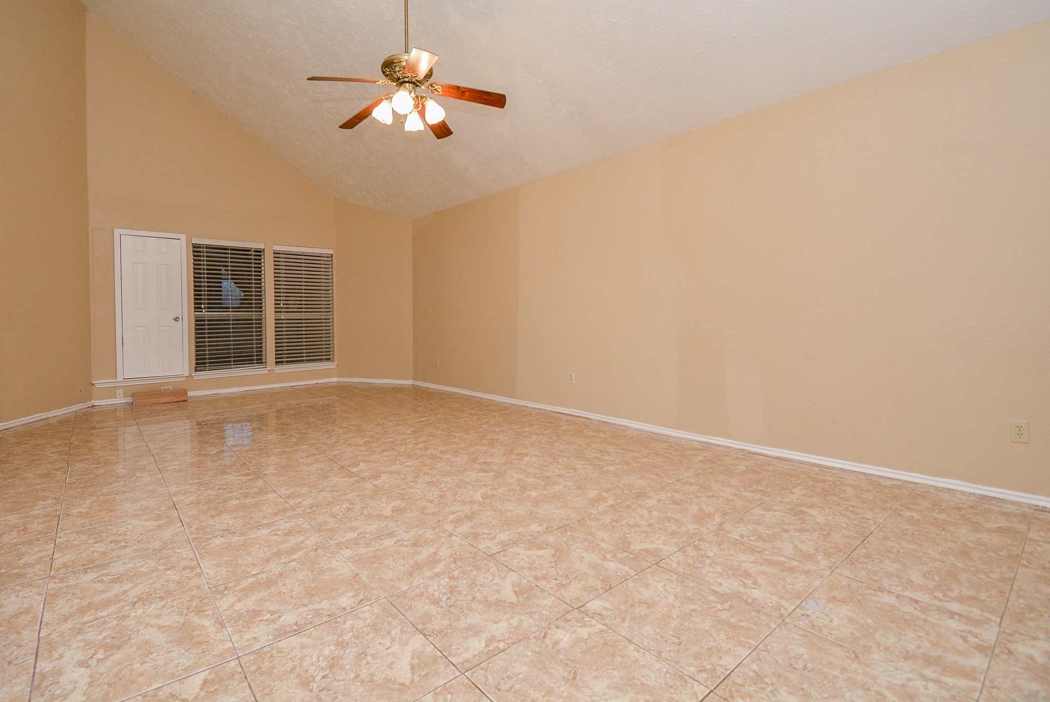 22906 Indian Ridge Drive Katy, TX 77450 - Photo 7 of 26 a view of wooden floor and a chandelier fan in a room