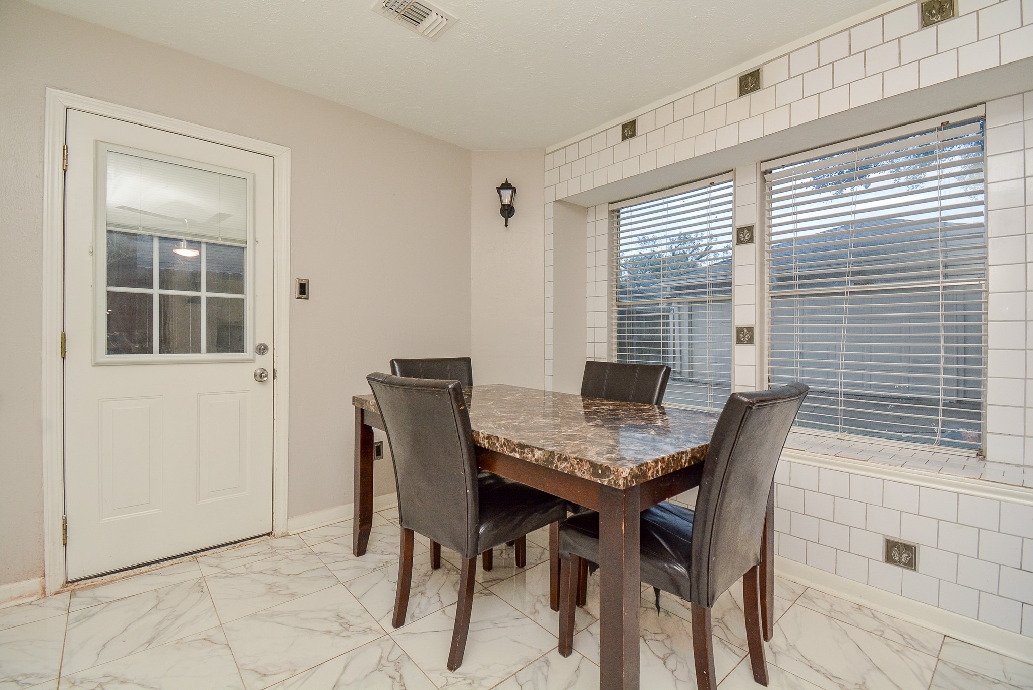 22906 Indian Ridge Drive Katy, TX 77450 - Photo 9 of 26 a view of a dining room with furniture and window