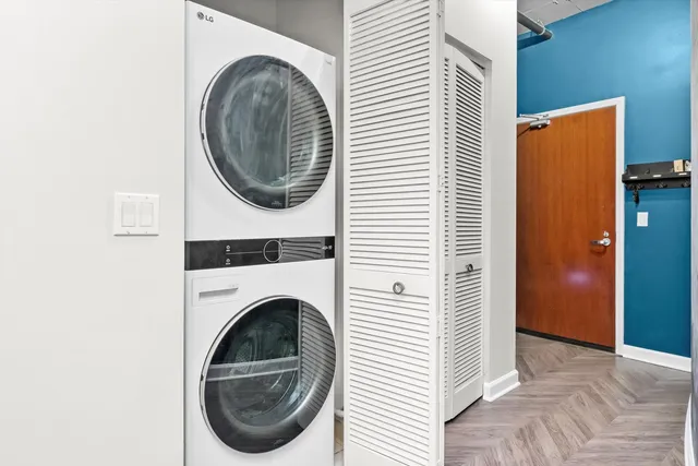 a view of a hallway with washer and dryer