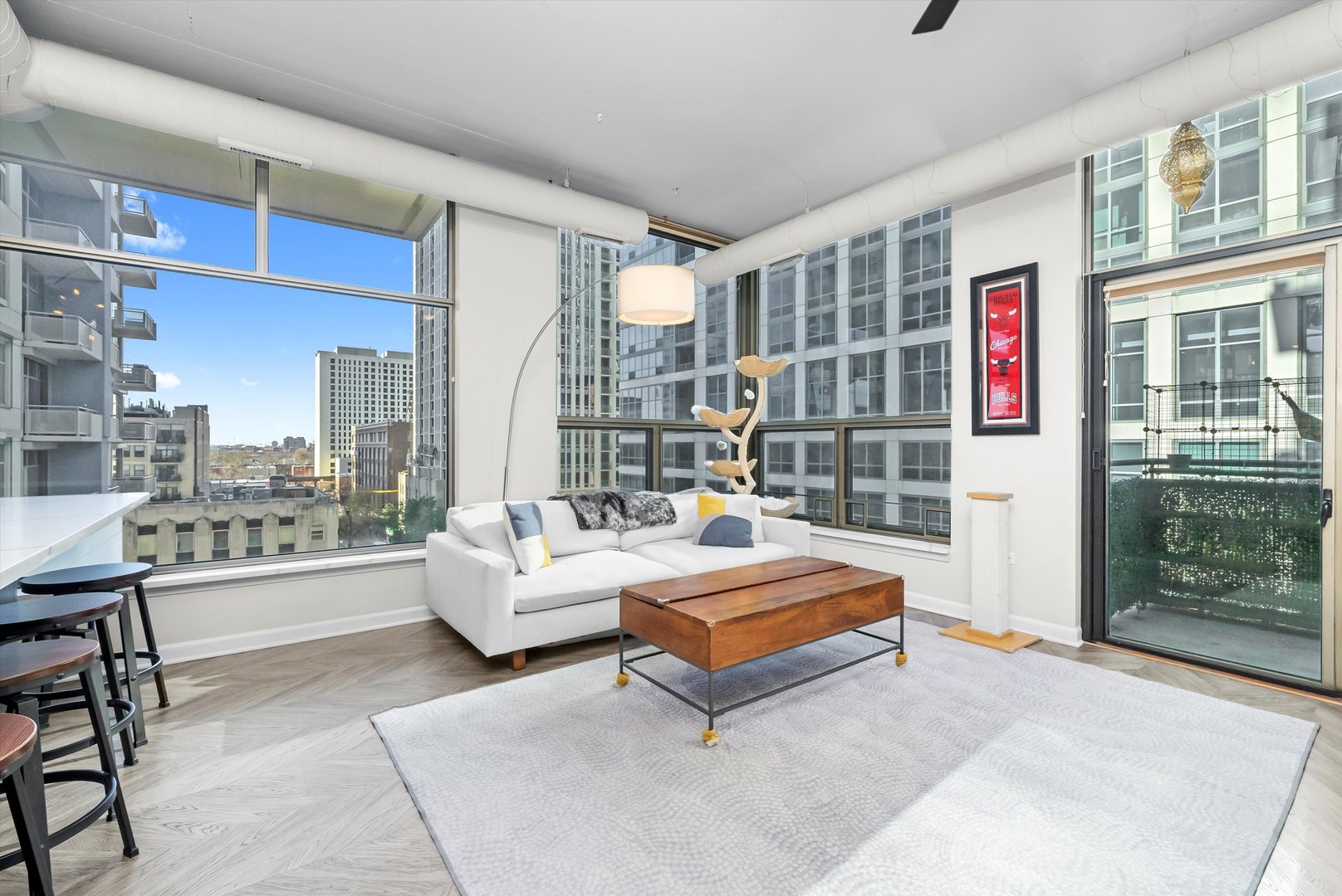 125 East 13th Street, Unit 601 Chicago, IL 60605 - Photo 3 of 25 a living room with furniture and a large window