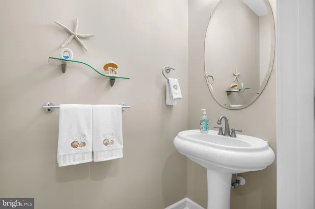 a bathroom with a sink and mirror