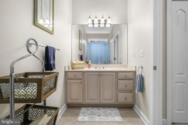 a bathroom with a toilet a sink and shower