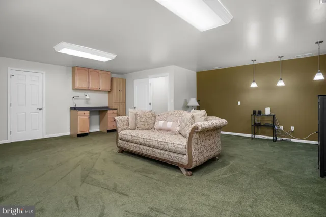 a living room with furniture and window