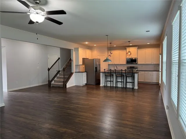 a view of kitchen and dining room with wooden floor