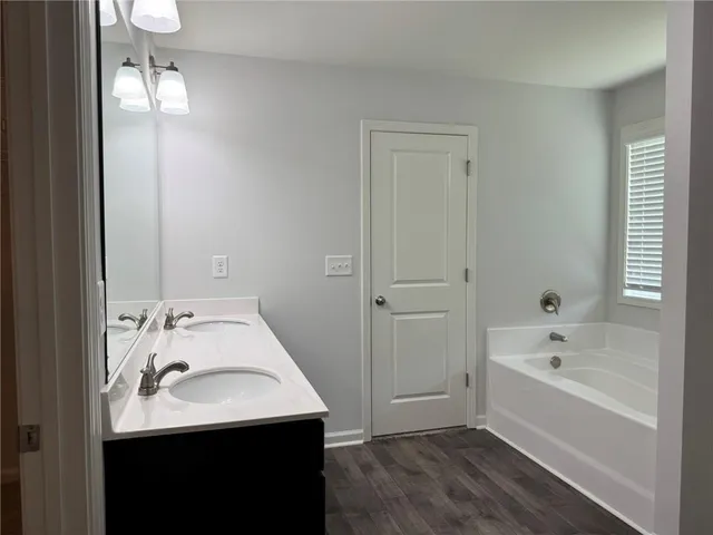 a bathroom with a sink and a bathtub