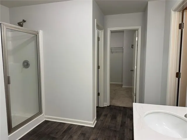 a view of a bathroom with a sink and shower