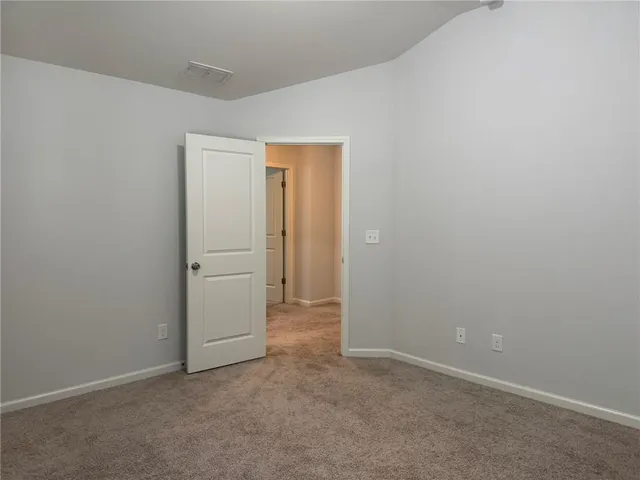 an empty room with closet area