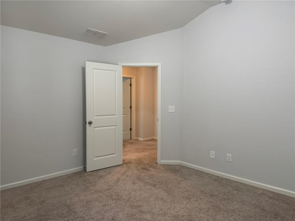 5414 Long Branch Way Flowery Branch, GA 30542 - Photo 32 of 37 an empty room with closet area