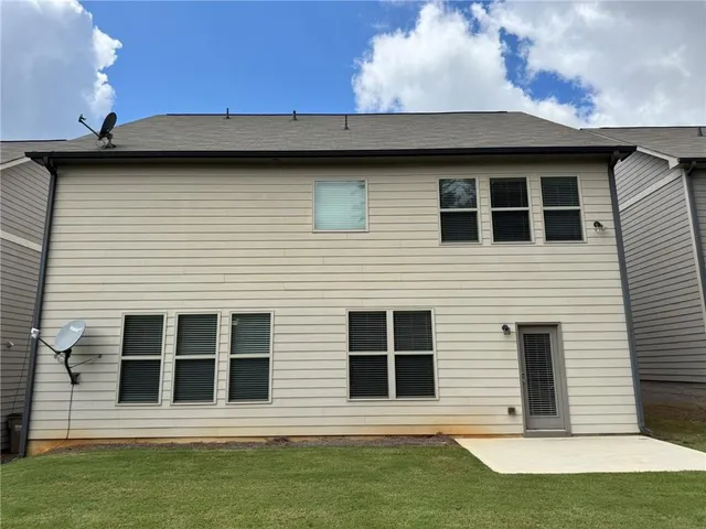 a view of a house with a large window