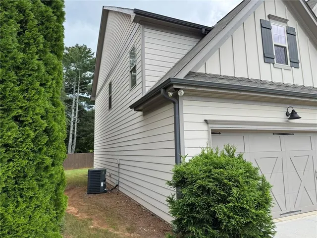 a view of a house with a yard and plants