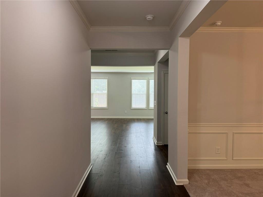 5414 Long Branch Way Flowery Branch, GA 30542 - Photo 6 of 37 a view of a hallway with wooden floor