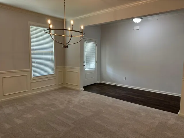 a view of a room with window and stairs