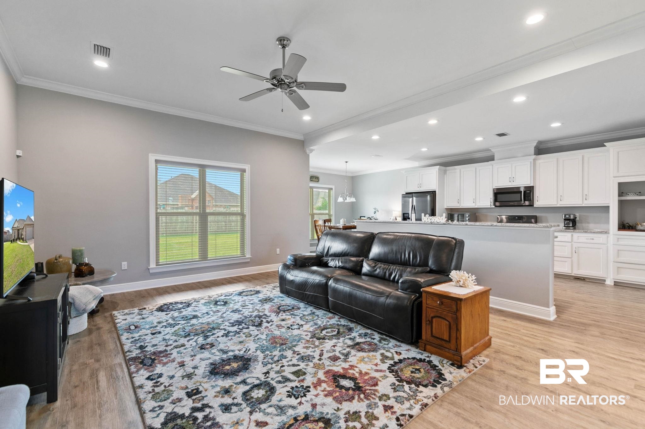9388 Pembrook Loop Fairhope, AL 36532 - Photo 10 of 53 Living room featuring ornamental molding, ceiling fan, light wood finished floors, a chandelier, and recessed lighting