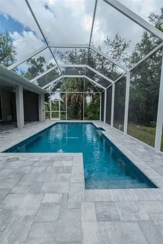 a view of pool with outdoor seating
