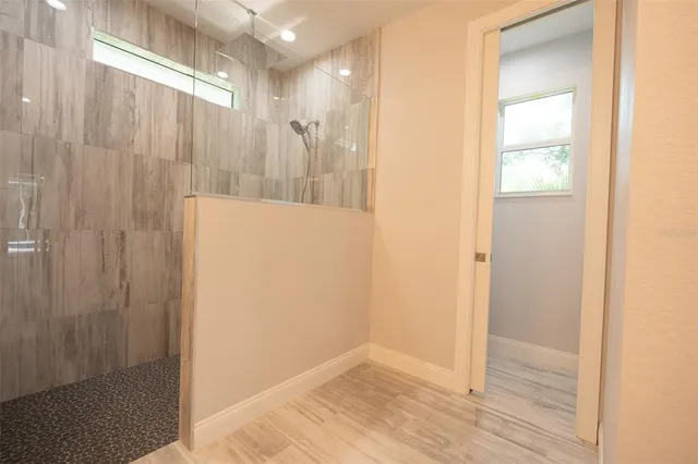 a view of a bathroom with wooden floor