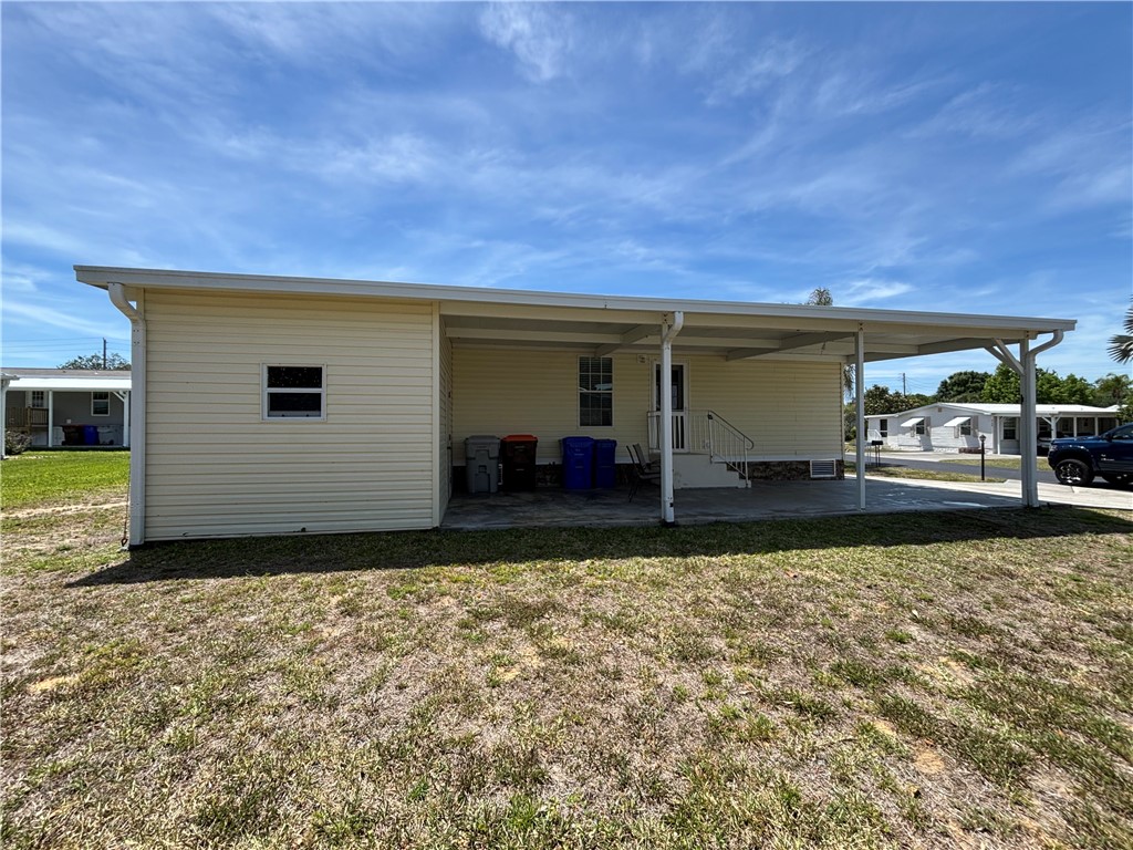 6171 98th Road Sebastian, FL 32958 - Photo 4 of 14 a view of a backyard