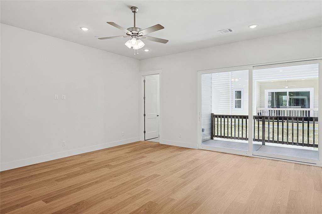 809 Concan Drive Plano, TX 75075 - Photo 11 of 40 Empty room with ceiling fan and light wood-type flooring
